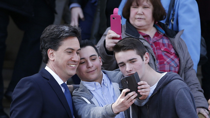 Britain's opposition Labour Party leader Ed Miliband poses for a selfie .