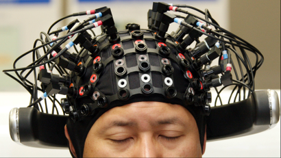Man wearing brain linking technology.