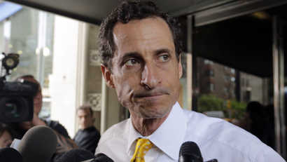 FILE - In this July 24, 2013 file photo, former New York Rep. Anthony Weiner leaves his apartment building in New York. The FBI informed Congress on Friday, Oct. 28, 2016, it is investigating whether there is classified information in new emails that have emerged in its probe of Hillary Clinton's private server. A U.S. official told The Associated Press the newly discovered emails emerged through the FBI’s separate sexting probe of former congressman Anthony Weiner, the estranged husband of close Clinton confidant Huma Abedin. (AP Photo/Richard Drew, File)