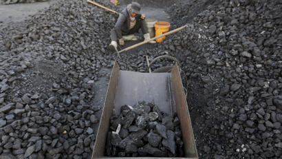 A villager selects coal at a coal mine in Heilongjiang province, China.