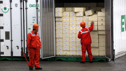 In this Wednesday, Dec. 7, 2011 file photo, custom officers check a container at the Yangshan Port in Shanghai, China. China says its trade rebounded in February after a Lunar New Year slowdown but a broader measure gave clear signs both global and Chinese demand are weakening. Customs data Saturday, March 10, 2012 showed exports grew 18.4 percent over a year earlier, up from January's 0.5 percent contraction. Imports jumped 39.6 percent, up from the previous month's decline of 15 percent.