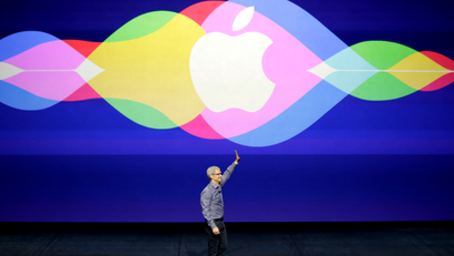 Apple CEO Tim Cook waves during the Apple event at the Bill Graham Civic Auditorium in San Francisco, Wednesday, Sept. 9, 2015.