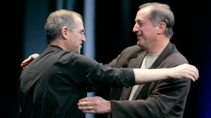 Apple CEO Steve Jobs hugs Intel President and CEO Paul Otellini at the Apple Worldwide Developer ...