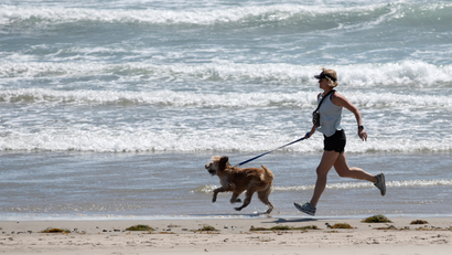 woman jogging with dog