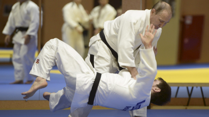 Putin works out seven days a week with swimming, gym, judo and hockey