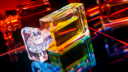 a perfume bottle with refracted light through it