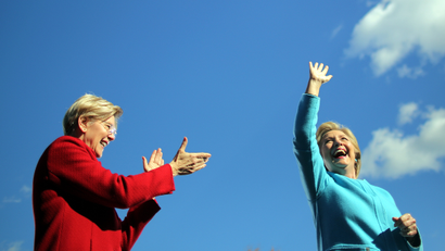 Democratic U.S. presidential nominee Hillary Clinton waves as she arrives to a campaign event accompanied by U.S. Senator Elizabeth Warren (D-MA) at Alumni Hall Courtyard, Saint Anselm College in Manchester, New Hampshire U.S., October 24, 2016.