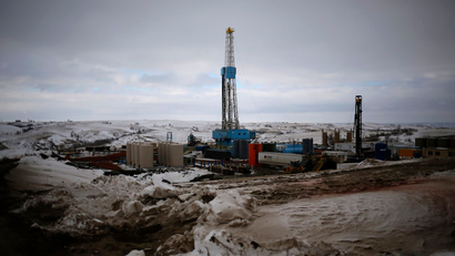 An oil derrick is seen at a fracking site for extracting oil outside of Williston, North Dakota.