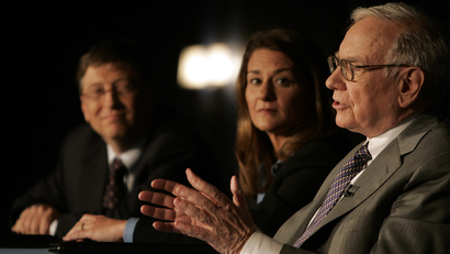 Bill Gates, left, Melinda Gates and Warren Buffett speak during a press conference Monday, June 26, 2006 in New York.
