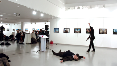 ATTENTION EDITORS - VISUAL COVERAGE OF SCENES OF DEATH Russian Ambassador to Turkey Andrei Karlov lies on the ground after he was shot by unidentified man at an art gallery in Ankara, Turkey, December 19, 2016. Depo Photos/Sozcu Newspaper via REUTERS ATTENTION EDITORS - THIS PICTURE WAS PROVIDED BY A THIRD PARTY. FOR EDITORIAL USE ONLY. NO RESALES. NO ARCHIVE. TURKEY OUT. NO COMMERCIAL OR EDITORIAL SALES IN TURKEY. TEMPLATE OUT - RTX2VQKB