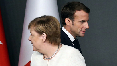 German Chancellor Angela Merkel and French President Emmanuel Macron are seen at a news conference after a Syria summit in October.