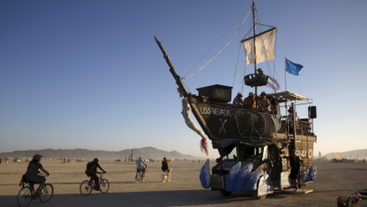 The USS Nevada, a Mutant Vehicle, carries participants on the Playa during the Burning Man 2015 "Carnival of Mirrors" arts and music festival in the Black Rock Desert of Nevada, August 31, 2015. Approximately 70,000 people from all over the world are gathering at the sold-out festival to spend a week in the remote desert to experience art, music and the unique community that develops.