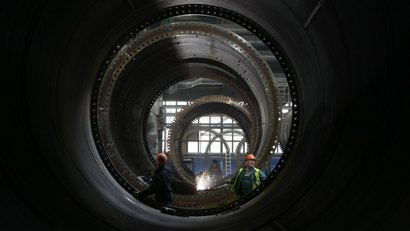 Workers weld a wind tower in Gdansk Shipyard May 30, 2012.