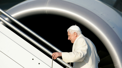 Pope Benedict XVI boards a plane