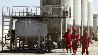 workers are seen at the al-Waha Oil Company in Wasit in southern Iraq. From among the most outspoken of critics of the 2003 U.S.-led invasion to topple former Iraqi dictator Saddam Hussein, China has emerged as one of the biggest economic beneficiaries of the war, snagging lucrative deals and shrugging off the security risks with the country's political instability for the promise of oil, while western firms were largely subdued in their interest in Iraq's recent oil auctions.