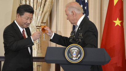 Biden and Xi Jinping raise their glasses in a toast during a luncheon at the State Department, in Washington, September 25, 2015.