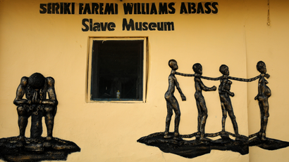 A bas-relief of shackled enslaved people on the wall of the Seriki Abass Slave Museum in Badagry, Lagos, Nigeria