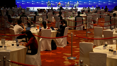 Attendees sit apart at social distanced tables segregated by ropes, during a conference held by the Institute of Policy Studies at Marina Bay Sands Convention Centre in Singapore January 25, 2021. Picture taken January 25, 2021. REUTERS/Edgar Su
