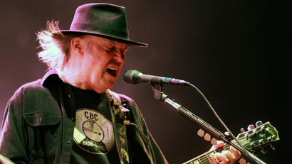 Musician Neil Young performs with his band 'Crazy Horse' during a concert in Biarritz, southwestern France, Thursday, July 18, 2013. (AP Photo/Bob Edme)