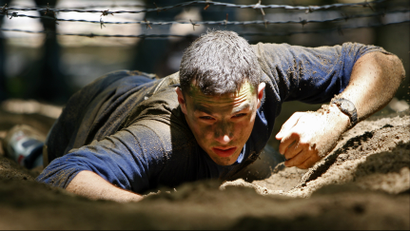 man crawling in mud