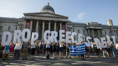 Demonstrators gather to protest against the European Central Bank's handling of Greece's debt repayments, in Trafalgar Square in London.
