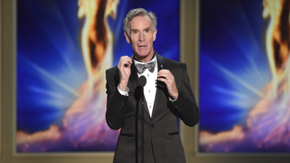 An image of Bill Nye speaking at a television event.