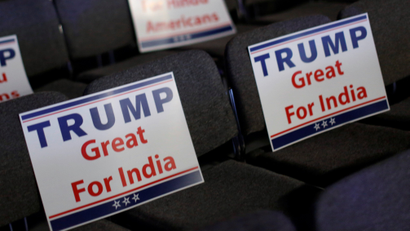 Signs are ready for attendees to hold during Trump's remarks at a Bollywood-themed charity concert put on by the Republican Hindu Coalition in Edison, New Jersey