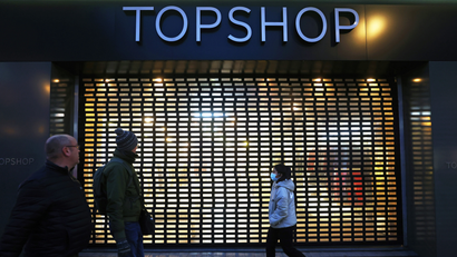 Pedestrians walk past a Topshop store, owed by Arcadia group on Oxford street in London, Britain, November 30, 2020