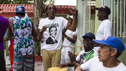 A musician performs wearing a T-shirt designed with an image of President Barack Obama at a weekly rumba dance gathering in Havana, Cuba