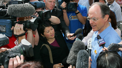 Don Brash talks to the media after casting his vote in Auckland during New New Zealand's general election in 2005