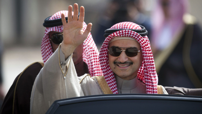 FILE - In this Feb. 4, 2014 file photo, Saudi billionaire Prince Alwaleed bin Talal, waves as he arrives at the headquarters of Palestinian President Mahmoud Abbas in the West Bank city of Ramallah. Bin Talal and his investment company have doubled their ownership of Twitter's publicly traded shares in the past six weeks. A joint statement released Wednesday, Oct. 7, 2015, by the prince and his Riyadh-based Kingdom Holding Company says their combined shares represent more than 5 percent of Twitter's common stock, with a market value of $1 billion. (AP Photo/Majdi Mohammed, File)