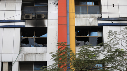 Damaged windows of Vijay Vallabh hospital are seen after it caught fire in Virar, on the outskirts of Mumbai