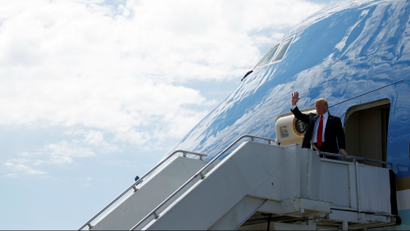 Donald Trump waves from Air Force One