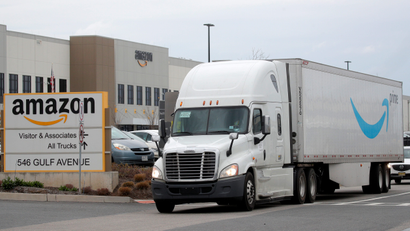 An Amazon truck exits a distribution center.