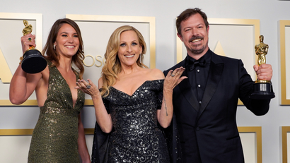 Pippa Ehrlich, Marlee Matlin, and James Reed, winners of the award for Best Documentary Feature for "My Octopus Teacher" pose at the Oscars on April 25.