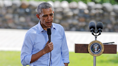 President Barack Obama ponders a question as he holds a town hall meeting at Minnehaha Park, Thursday, June 26, 2014, in Minneapolis. Obama said that Washington needs to stop "playing to the most fringe elements of politics" and help Americans who are fighting to make ends meet, as he spent an afternoon with a working mother who wrote to him about her struggles. (AP Photo/Jim Mone)