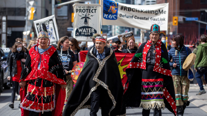 Wet'suwet'en hereditary chiefs, who are fighting against the building of a pipeline by TC Energy in British Columbia, march to the Royal Bank of Canada (RBC) head quarters after visiting the RBC annual general meeting, which was moved to a virtual event, in Toronto, Ontario.