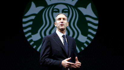 In this Wednesday, March 20, 2013, file photo, Starbucks CEO Howard Schultz speaks at the company's annual shareholders meeting,in Seattle, Wash. Starbucks Corp. reports quarterly financial results after the market closes on Thursday, April 25, 2013.