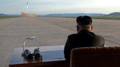 North Korean leader Kim Jong Un watches the launch of a Hwasong-12 missile in this undated photo released by North Korea's Korean Central News Agency (KCNA) on September 16, 2017.
