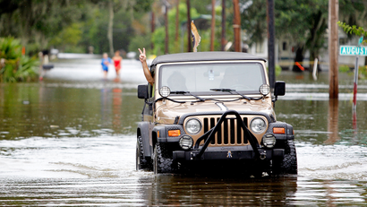 Jeep driving through water.