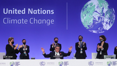 COP26 President Alok Sharma gestures as he receives applause during the UN Climate Change Conference (COP26) in Glasgow, Scotland.
