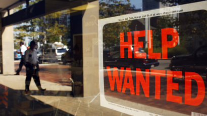 A "Help Wanted" sign in the window advertises a job opening at a dry cleaners in Boston
