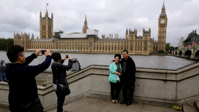 Chinese tourists take pictures near the Big Ben clock tower in London, Britain June 29, 2016. REUTERS/Kevin Coombs