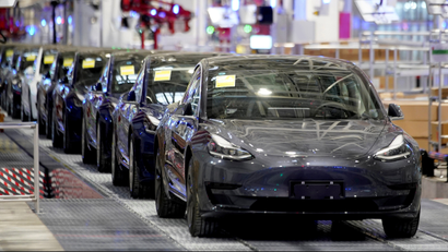 Tesla vehicles are lined up at a factory in Shanghai.