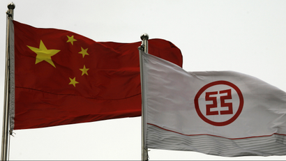 A flag printed with a logo of the Industrial & Commercial Bank of China (ICBC) flies along with a Chinese flag outside a branch in China's southern city of Shenzhen March 25, 2010. ICBC, the world's most valuable lender, reports its quarterly results on Thursday. REUTERS/Bobby Yip