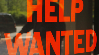 Help wanted sign in the window
