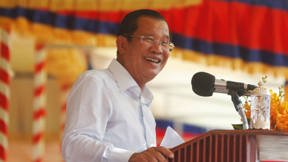 Cambodia's Prime Minister Hun Sen smiles during a rally in with garment workers in Kandal province, Cambodia, July 4, 2018.
