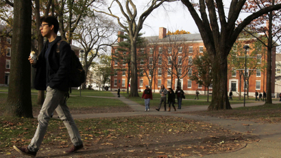 A man walks through Harvard Yard at Harvard University in Cambridge, Massachusetts.