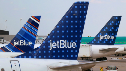 JetBlue Airways aircraft at departure gates at John F. Kennedy International Airport in New York