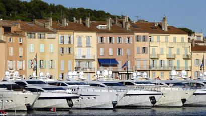 Docked luxury yachts are seen in Saint-Tropez harbour on the French Riviera July 30, 2010. REUTERS/Charles Platiau